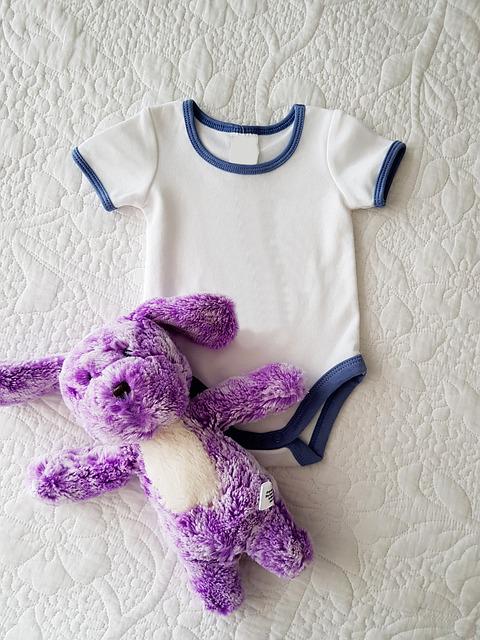 baby clothes and stuffed animal