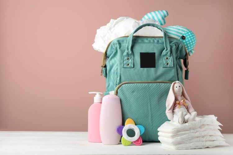 Diaper bag packed with supplies for twins
